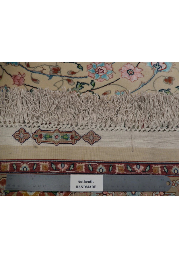 Ruler across backside showing extremely dense hand knotted weave of 660 to 680 knots per inch