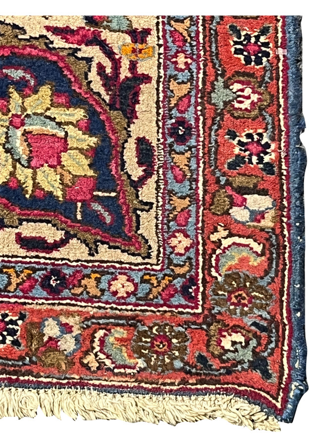 Ivory and rust border detail on distressed hand knotted Mashad with light blue guard bands