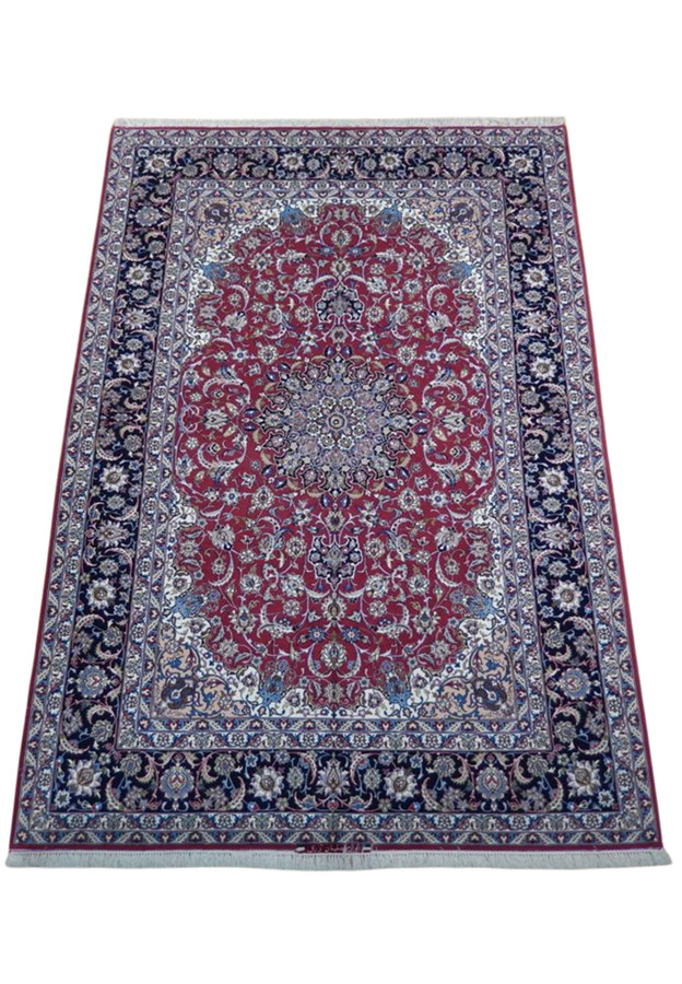 Top view of wool and silk Isfahan showing navy palmette border and ivory corner reserves