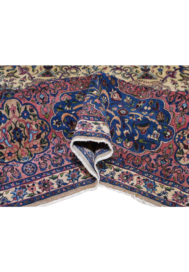 Folded corner revealing supple wool handle and softly settled pile of 1880s Kerman