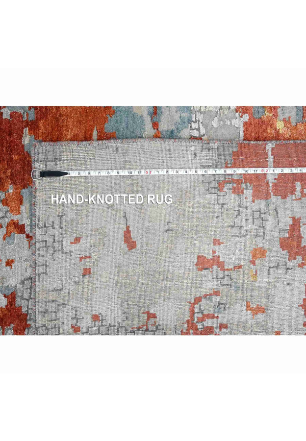 Back of hand-knotted rug with tape measure across even knots proving genuine handmade construction