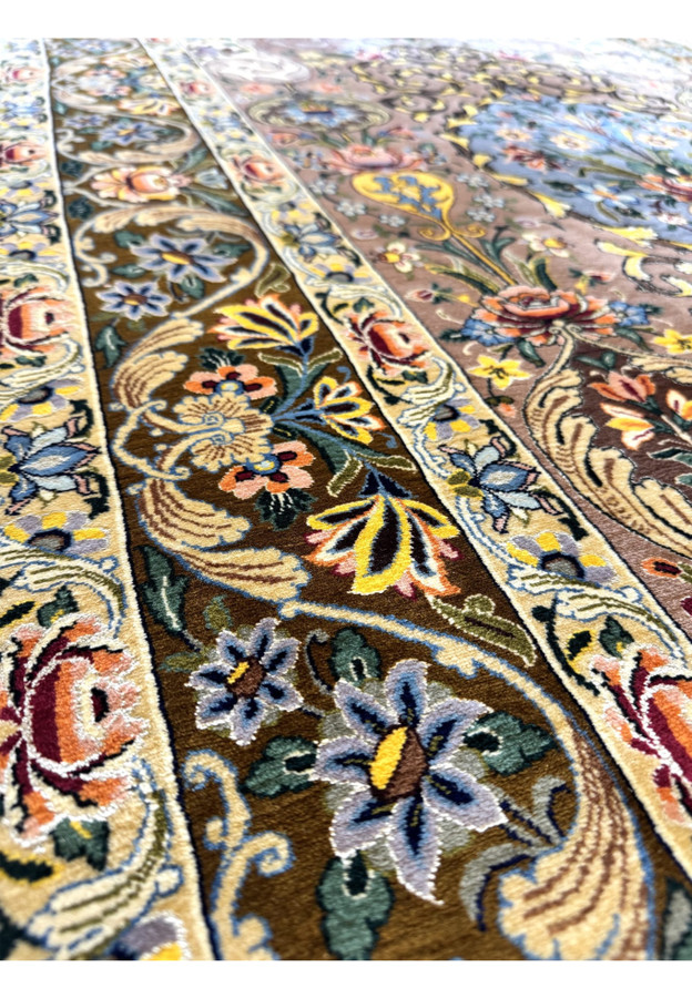 Feathered leaves and blossoms in powder blue and coral along the olive brown border