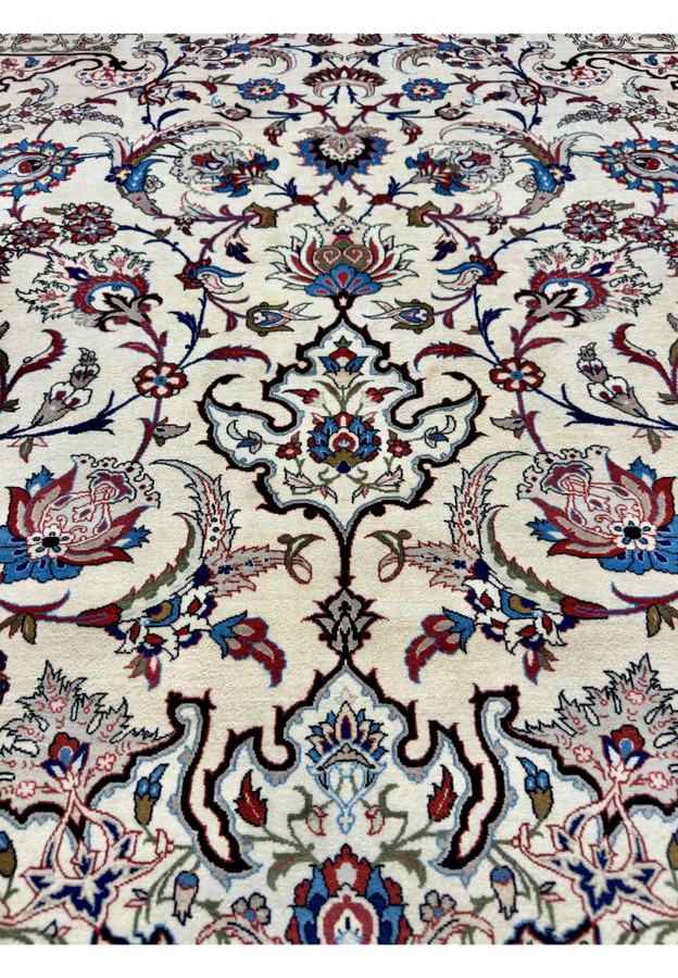 9x12 Isfahan rug pattern radiating symmetrically from the medallion, ideal for a formal living room