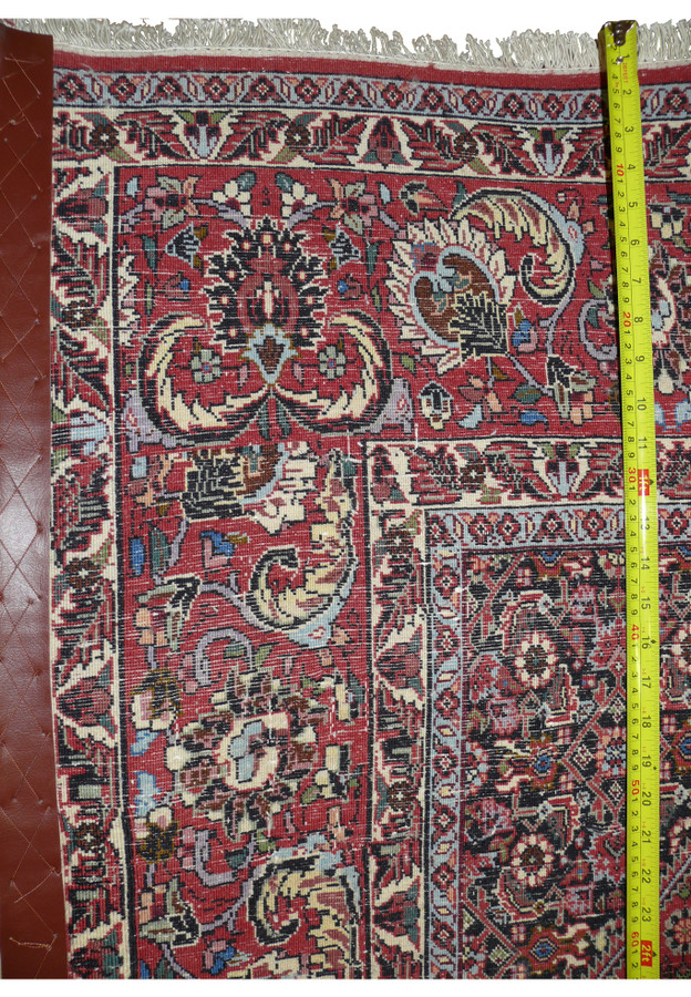 6'4 x 10'5 Bijar rug reverse with tape measure showing the dense, tightly packed hand-knotted weave