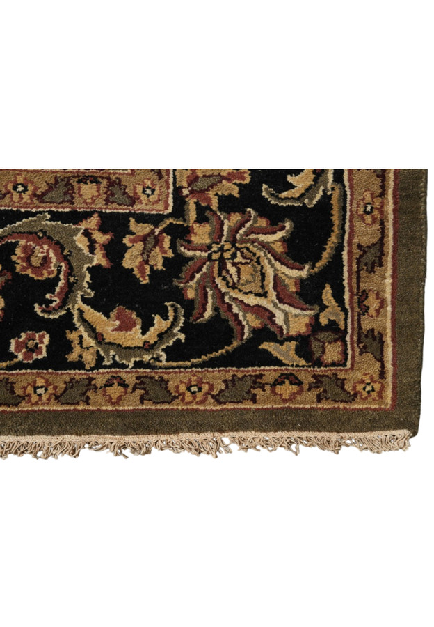 Bold black main border with a scrolling floral vine of palmettes in gold, rust and cream