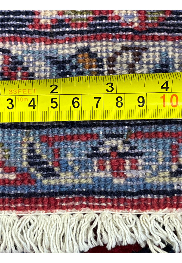 10x16 Najafabad rug back with tape measure showing about 15 knots to the inch