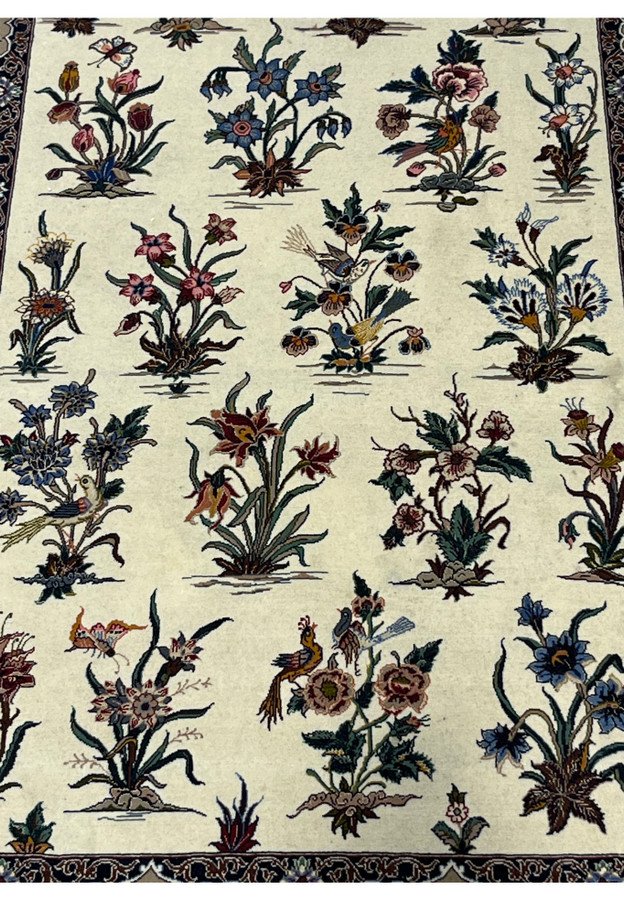 Songbirds perched among tulips, cornflowers and pansies on the plain ivory ground