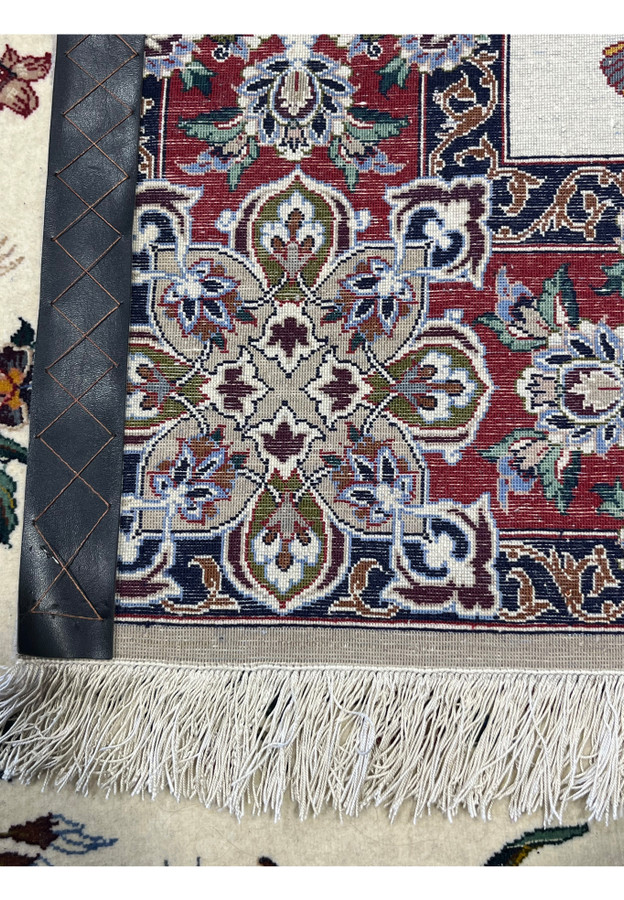Back of the rug showing the fine knot grid over a pure silk foundation