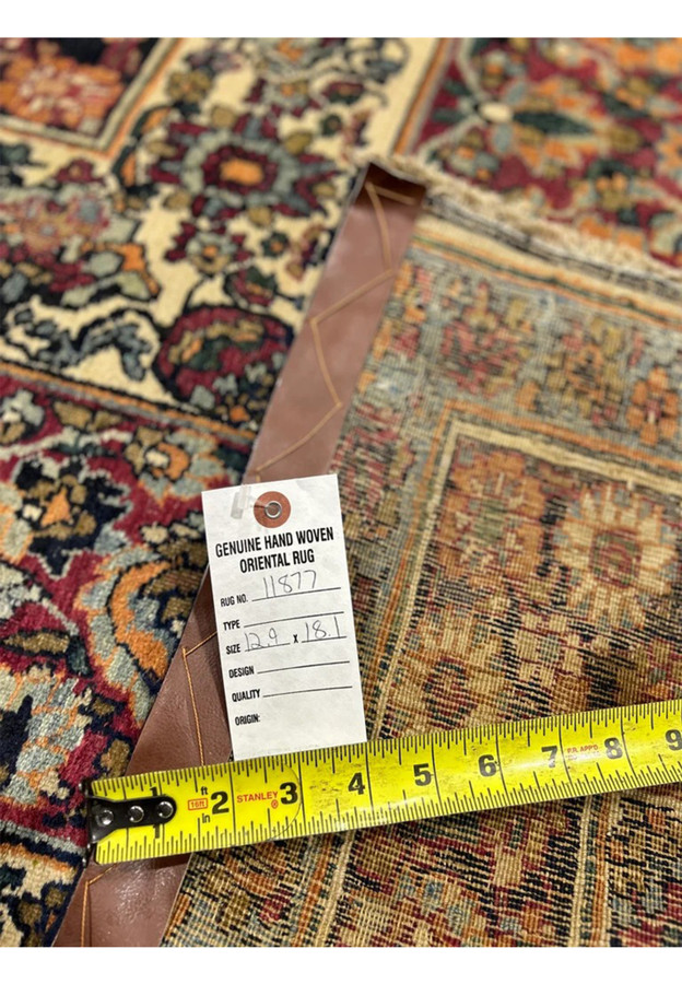 Tape measure and inventory tag on the reverse confirming the 12'9 x 18'1 dimensions