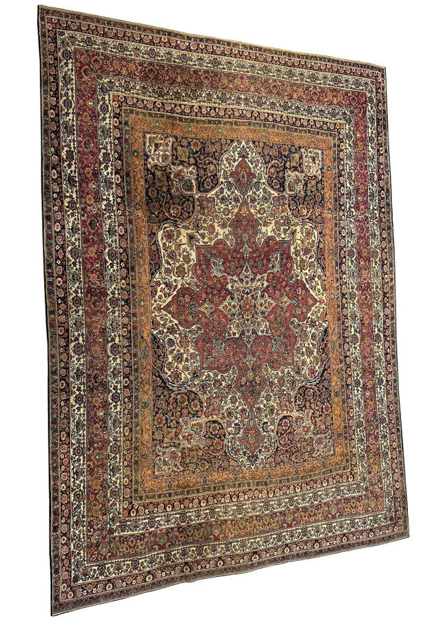 Side view of the oversize Kermanshah rug with border repeats running the full length