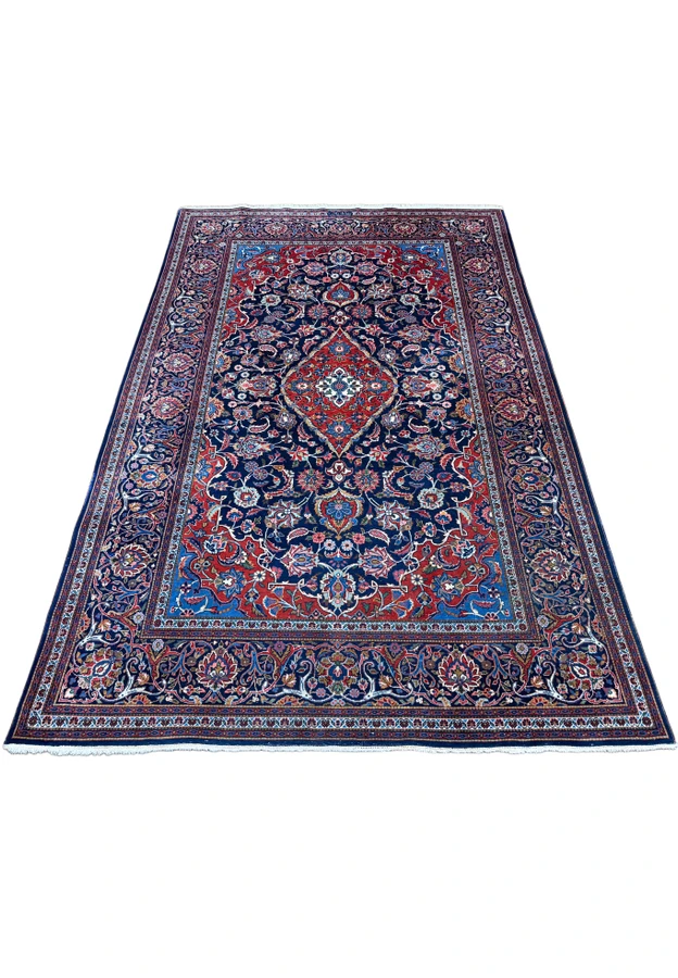 Antique 1920s Kashan Safazadeh rug laid flat showing classic medallion and border design