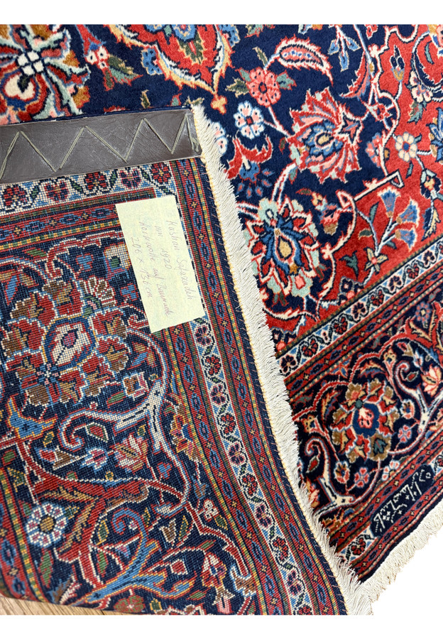 Back of antique Kashan with German dealer label confirming Safazadeh circa 1920 origin
