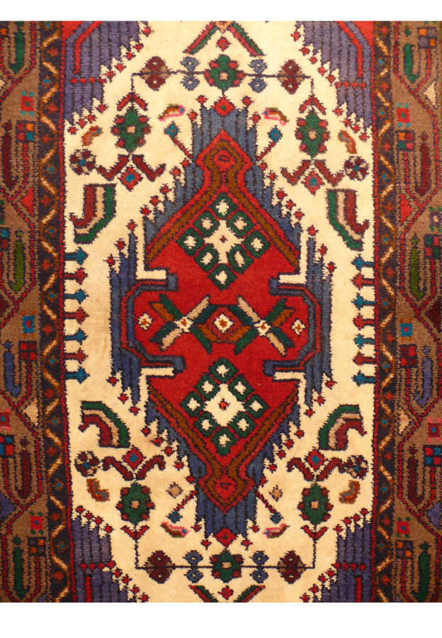 Close-up showing the intricate weave and vibrant color palette of the Persian Hamedan rug