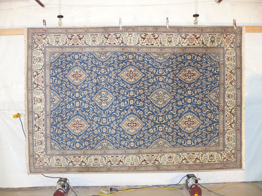 Hand-knotted wool and silk texture of the 7 x 10 Persian Nain 9 LAA rug