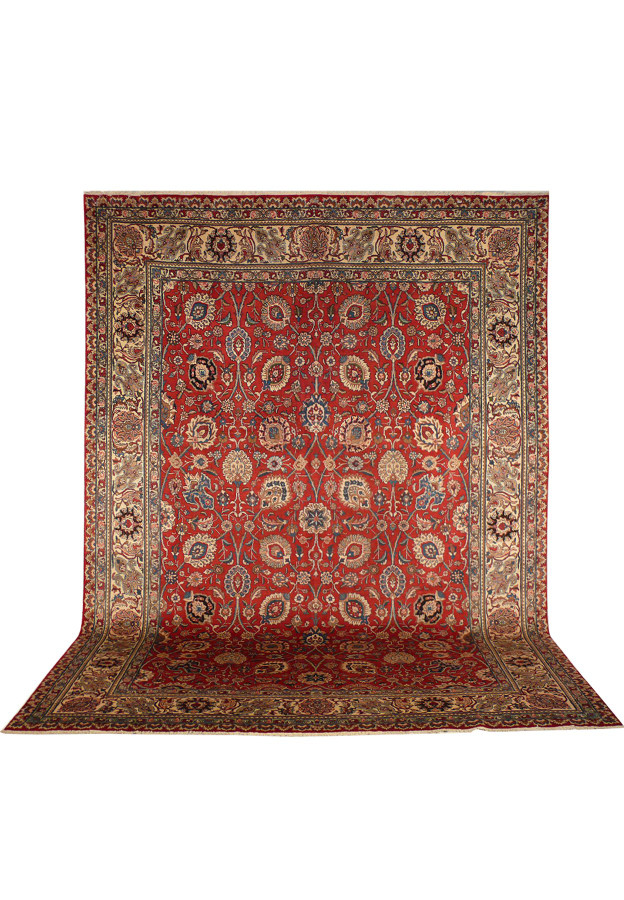 Vintage Persian Tabriz allover rug hanging flat showing rusty red field and navy border
