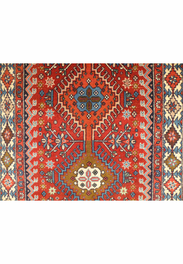 Close-up of the fine wool texture on the 3' x 14' Persian Geometric Yalameh Rug