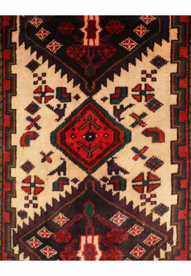 Close-up view of intricate patterns on the 3'3 x 5 Antique Persian Hamedan rug