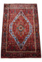 Perspective view of a Persian Gholtogh Rug, showing the detailed patterns that extend across its entire surface