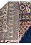 Folded to see the back of the rug in order to emphasize the quality of this 120 year old antique Persian Tabriz rug.