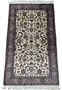 Entire 3x5 Tabriz Oriental rug displayed with ornate floral and dark accent designs on a light field