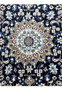 Close-up of the Persian Nain rug's central medallion detailing the fine craftsmanship and vibrant color palette