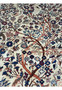 Close-up view of the upper part of a 4'2" x 6'9" Antique Persian Kashan rug, emphasizing the Tree of Life's branches and surrounding animal figures in vibrant hues