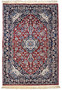 Full view of handmade Persian Isfahan wool and silk rug with traditional design and fringed edge