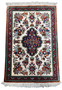 Entire 2 x 2'7 Persian Qum silk rug showcasing intricate floral designs and a dense, high-knot composition