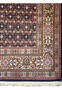 Detailed view of the Persian Moud Rug's border design featuring traditional Persian floral motifs.
