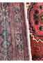 Texture-focused close-up of the Persian Baluch rug, illustrating the high-quality weave and color depth