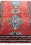 Close-up of the central part of a Persian Hamedan rug showing intricate weaving and vibrant colors