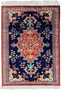 Elegant Persian Qum silk rug with a central floral medallion set against a navy blue background and an ornate border