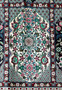 Perspective shot of a Persian Qum silk rug, highlighting the depth of design and vibrant colors