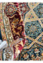 Edge view of the rolled Persian Qum silk rug, highlighting the compact weave and the rug's thickness