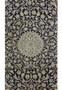 Detailed view of the Persian Nain 9 LAA Rug showcasing the delicate silk highlights on a deep blue background with floral motifs