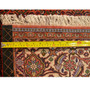 Measuring tape on the fringe of a Persian Bijar Rug, indicating its size and demonstrating the fine edge detail