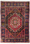 Top view of a Persian Gholtogh rug laid flat, displaying the full intricate design and vibrant color palette with a prominent red central medallion