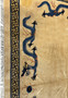 Detailed shot highlighting the Greek key border and dragon design of the Chinese Beijing Dragon Rug