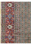 Side view of the Persian Moud Rug focusing on the multicolored fringe and the finely knotted edge of the border.
