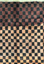 Close-up of the Nepal rug showcasing the intricate weave and color variations in the checkerboard design with brown and beige squares.