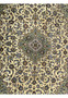 Close-up of the central part of a Persian Kashan rug, highlighting the elaborate medallion and florid motifs in blue, gold, and cream