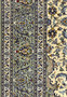 Detailed view of the Persian Kashan rug's border with intricate floral designs and vine patterns in a symmetrical layout