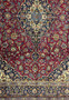 Magnified view of the Persian Kashan rug's pattern work, displaying the expert craftsmanship and varied color scheme