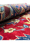 A close-up of a 10 x 15 Persian Isfahan rug showing the plush pile and detailed craftsmanship, with a focus on the vivid floral designs and color contrast