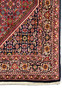 Corner detail of a 3x5 Persian Bidjar Rug, exhibiting quartered medallions and the seamless integration of floral designs within the dense weave