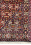 Corner detail of a 3 x 4'7" Persian Bidjar rug, with quartered medallions and a decorative border on a white backdrop
