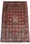 Angled view of a 3 x 4'7" Persian Bidjar rug, highlighting the detailed patterns and vibrant color palette on a white background