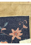 Zoomed-in view of a 1960s Vintage Art Deco Rug corner, illustrating the fine details and weaving technique of the floral design against the navy border back of the rug