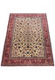 Complete rug display on a flat surface, showcasing the detailed floral and geometric designs and rich color scheme.