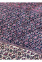 This image shows a detailed close-up of an 11'5" x 11'5" Persian Bijar rug. The rug features a richly detailed pattern with a dense array of floral and geometric motifs, intricately woven in a stunning color palette of deep blues, vibrant reds, and creamy beiges. The traditional design is highlighted by the finely knotted texture, showcasing the craftsmanship and artistry of this luxurious, square rug